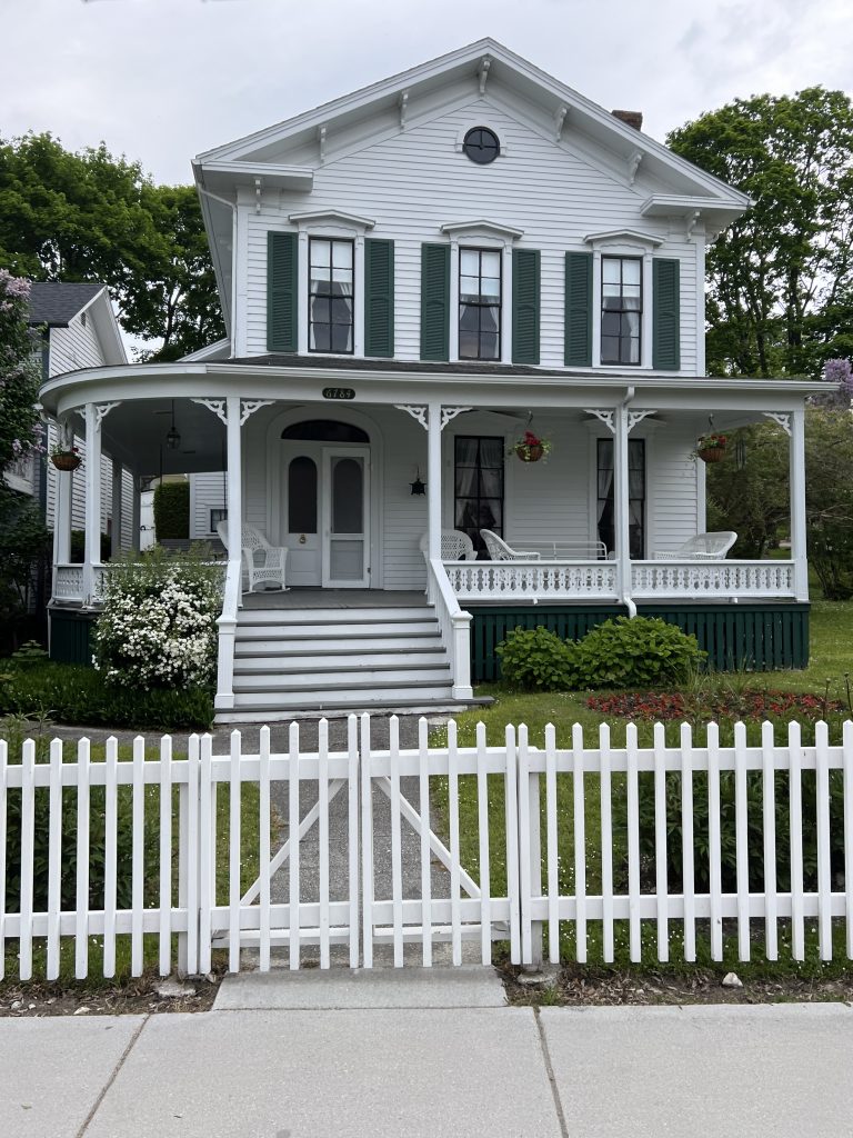 White Victorian home with green shutters - Somewhere In Time Movie Locations